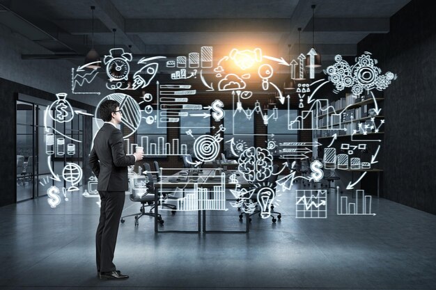 Man with coffee and startup on glassboard